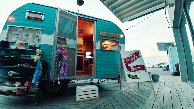 The Little Detour Photo Booth 1967 Frolic camper sitting on the Asbury Park Boardwalk