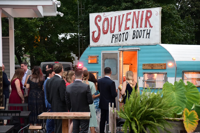 Wedding guests lined up outside of The Little Detour Photo booth at Everly at Railroad in Tuckahoe New Jersey